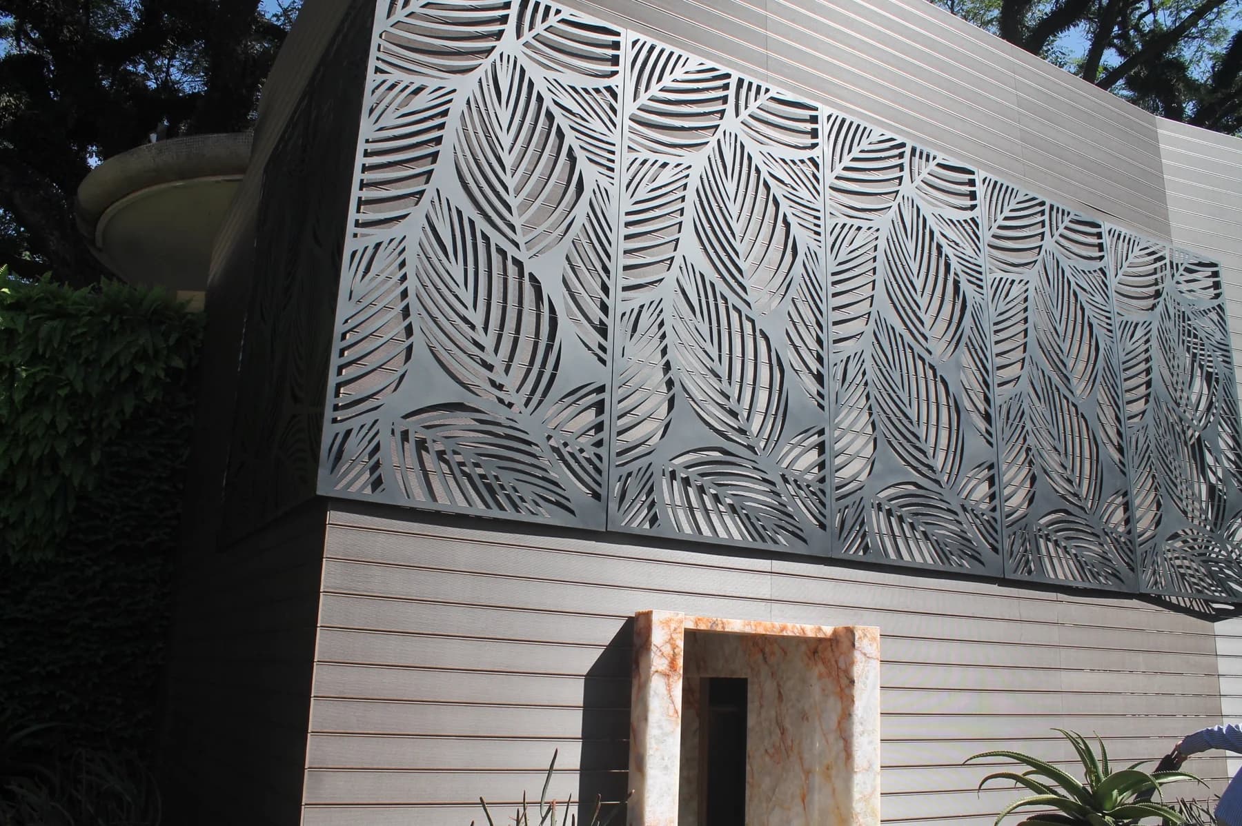 Laser-cut artistic metal panel integrated into a high-end interior